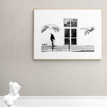 Paris, France. Man, 2 dogs, 2 hands. From Eric Schneider's 'Street' photography series. Black and white photography wall art for homes, offices, hospitals, hotels, restaurants bars and cafes. An extensive collection for collectors, art buyers, interior designers and individuals.